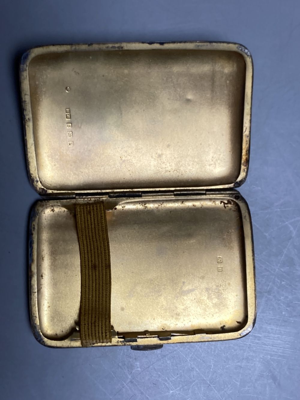 A pair of oval silver salts and spoons (cased), a butter knife and preserve spoon (cased), two pepperettes & a silver cigarette case